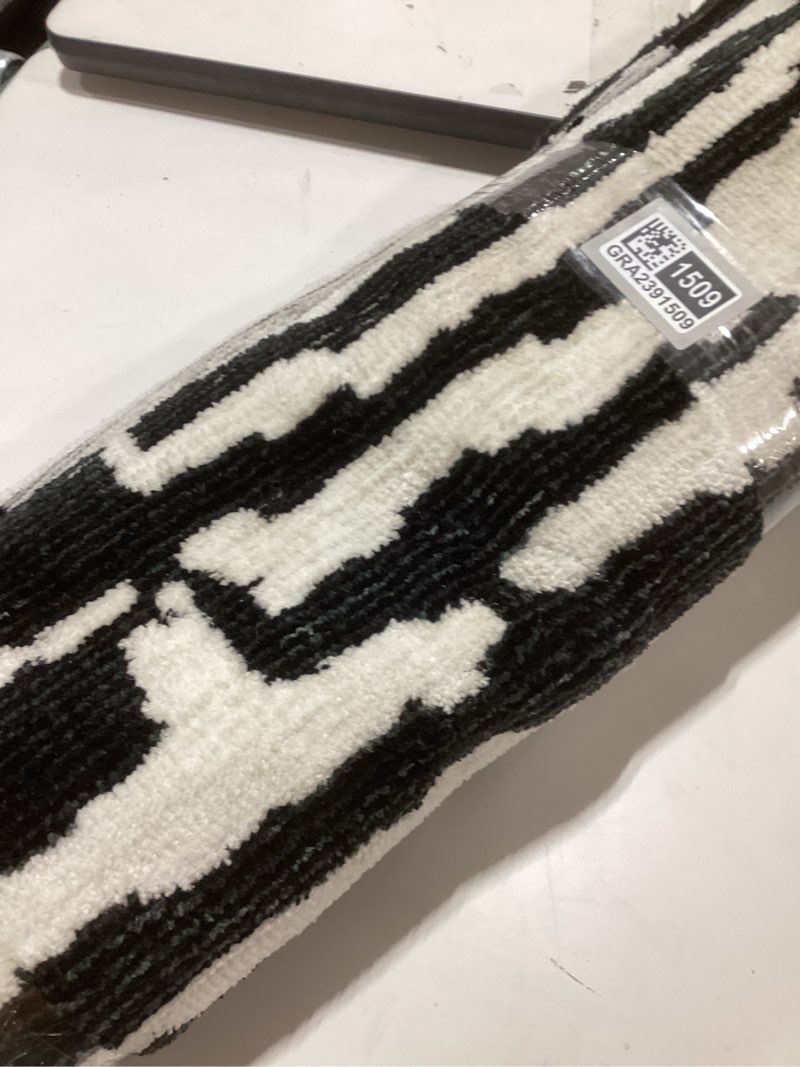 Condition photo showing New/Like New for Signature Design by Ashley Bramshaw Modern Indoor Striped 5 x 7 Rug, Black & White 5'2" x 6'9" (Rectangular)