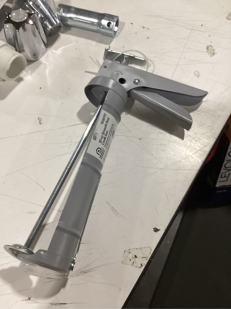 Condition photo showing As Is for project source 10 -oz smooth rod caulk gun