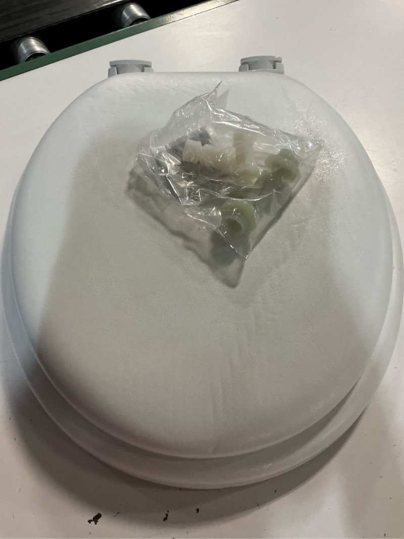 Condition photo showing As Is for mayfair by bemis eden cushioned vinyl white round padded toilet seat