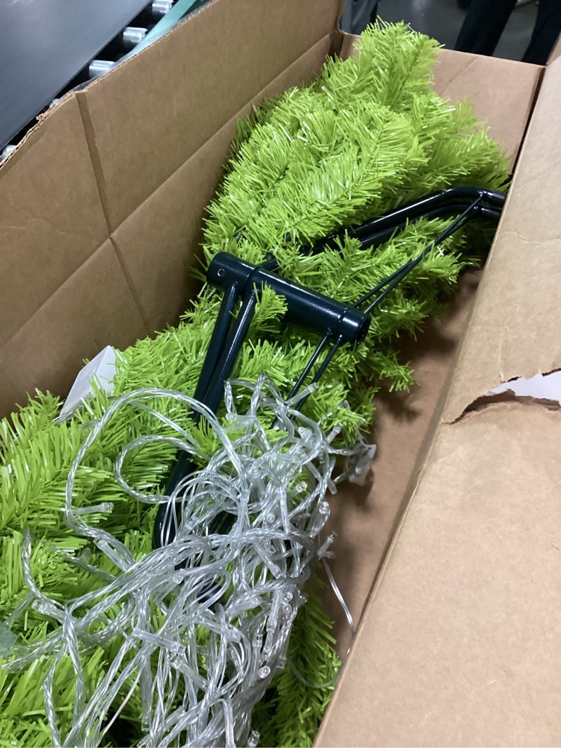 Condition photo showing As Is for 6FT Large Artificial Christmas Tree Xmas Holiday Whimsical Pre-Lit Green Tree with 100 LED String Lights for Indoor & Outdoor Christmas Party Decor for Home Office Bendable and Portable