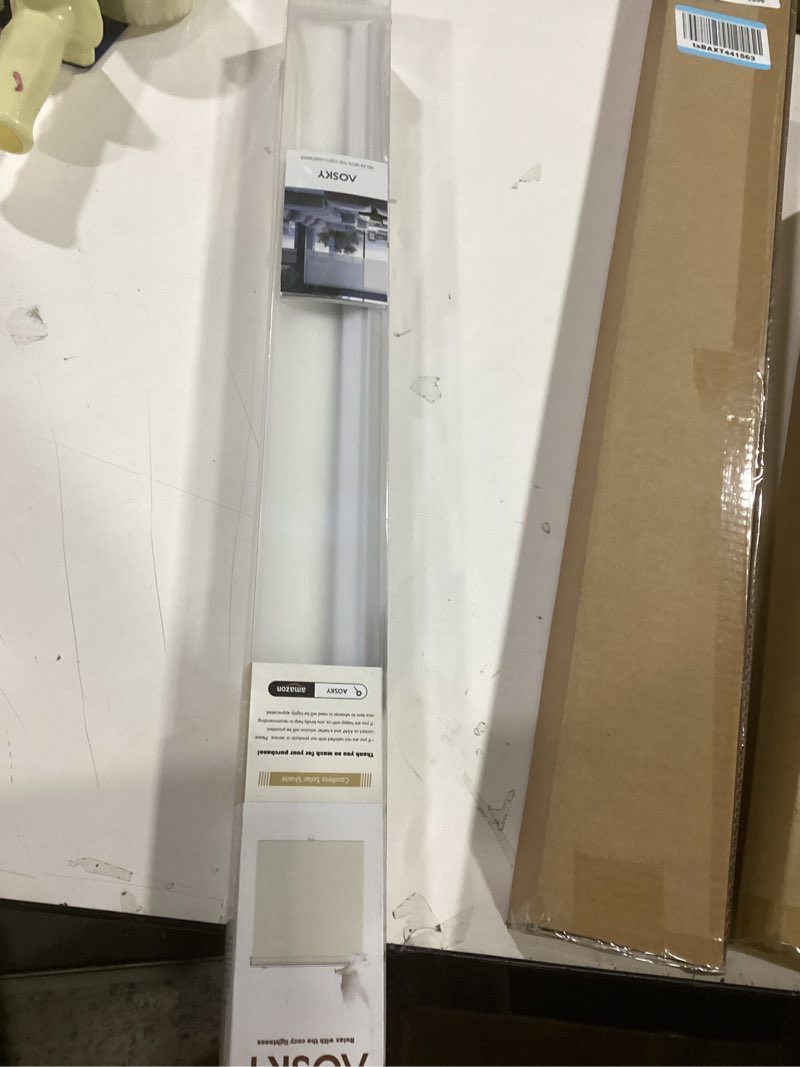 Condition photo showing New/Like New for AOSKY Cordless Roller Shades for Windows Light Filtering Shades with 5% Openness Solar Screen Semi Sheer Roller Blinds UV Protection for Office and Home. Easy to Install 25" W x 72" H (White) 25"W x 72"H White