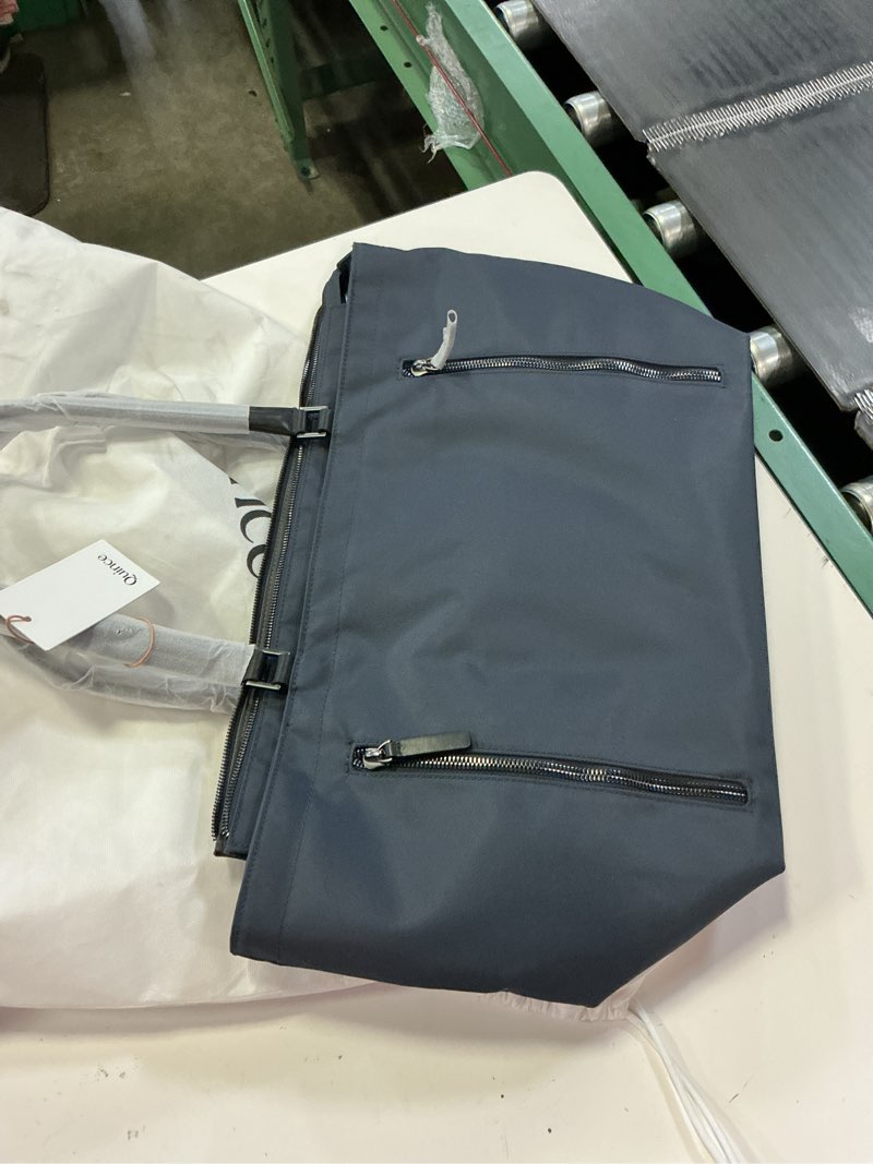 Condition photo showing Good Condition for quince sneakily dropped a new line of multi-pocketed travel bags blue