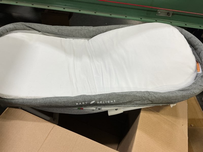 Condition photo showing As Is for Baby Delight Snuggle Nest Bassinet, Portable Baby Bed, for Infants 0 – 5 Months, Charcoal Tweed