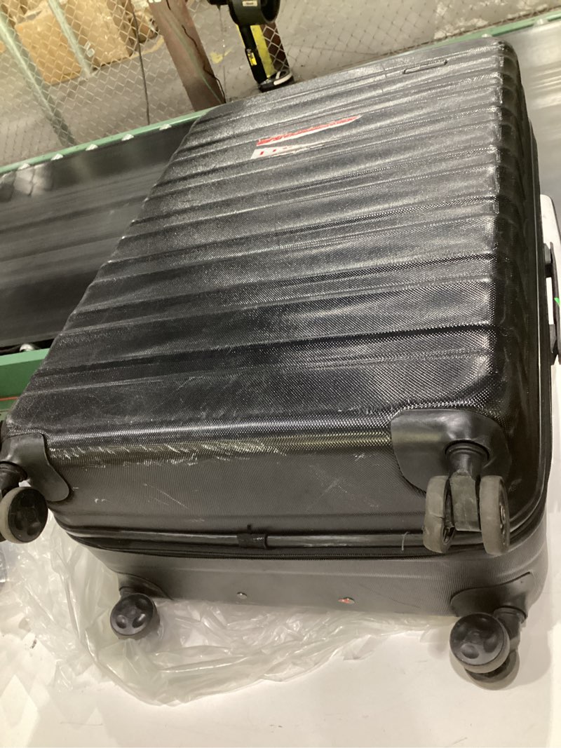 Condition photo showing As Is for (used)amazon basics 30\" hardside large checked luggage, hardshell suitcase with wheels, expandable for up to 15% more space, with scratch-resistant surface, four multi-directional wheels, black black large checked