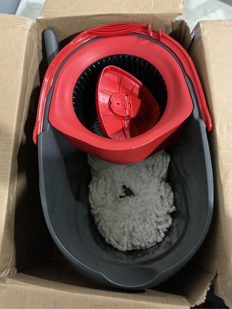Condition photo showing As Is for o-cedar easywring 12 in. w spin mop with bucket