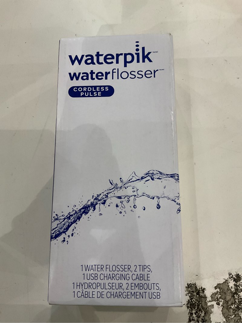 Condition photo showing New/Like New for Waterpik Cordless Pulse Rechargeable Portable Water Flosser for Teeth, Gums, Braces Care and Travel with 2 Flossing Tips, Waterproof, ADA Accepted, WF-20 Blue, Packaging May Vary