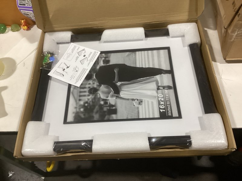 Condition photo showing New/Like New for Yaetm 16x20 Black Picture Frame with Decorative Inner Frame & Tempered Glass, Display 11x14 Photos with Mat on Wall - Portrait or Landscape - Ideal for Office & Home Décor (Black, Single) 16x20 - 1 pack Black