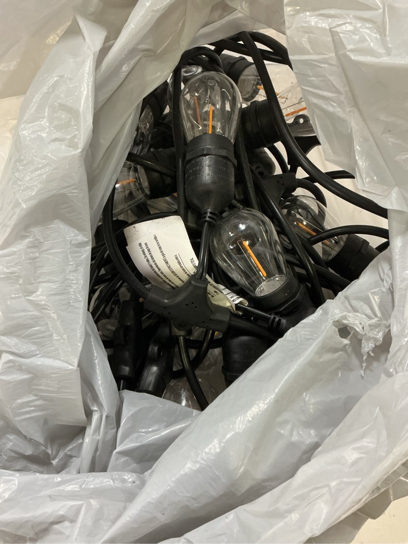 Condition photo showing As Is for 100+ bought last week harbor breeze 48-ft plug-in black indoor/outdoor string light
