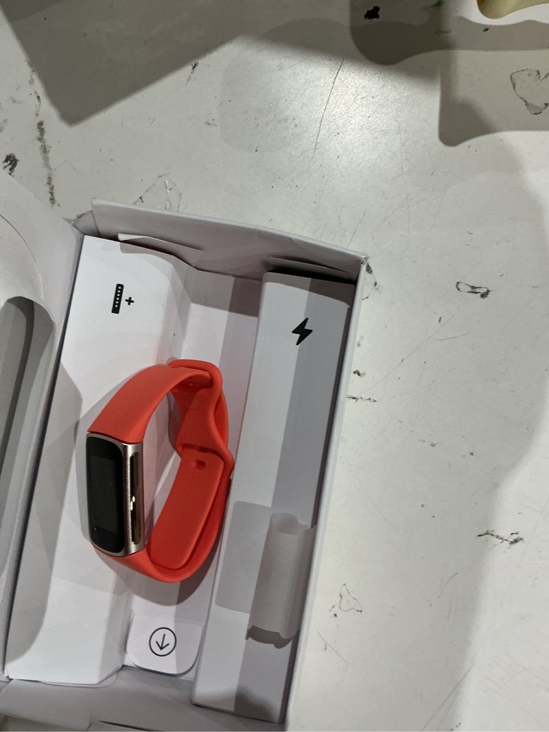 Condition photo showing As Is for fitbit charge 6 fitness tracker with google apps - heart rate on exercise equipment - 3-month google health premium membership included - health tools - gold/coral - small&large bands included gold case w/ red band tracker
