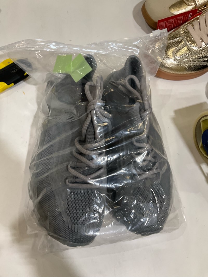 Condition photo showing As Is for Grey shoes