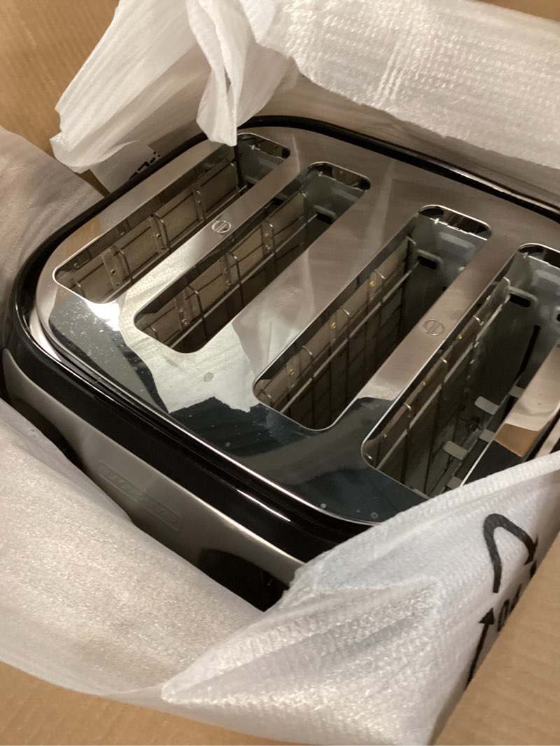 Condition photo showing As Is for black+decker 4-slice toaster, extra wide slots, 7 shade settings, 1400 watts, frozen and bagel buttons, toast shade selector, extra lift