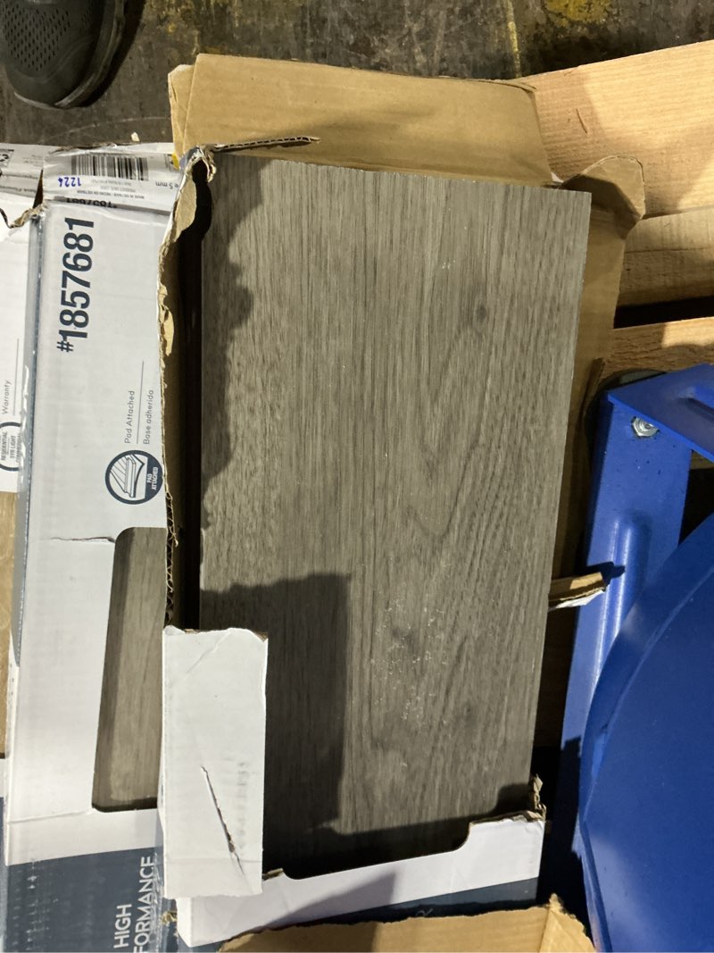 Condition photo showing As Is for Style Selections Charleston Oak 12-mil x 7-in W x 48-in L Waterproof Luxury Vinyl Plank Flooring