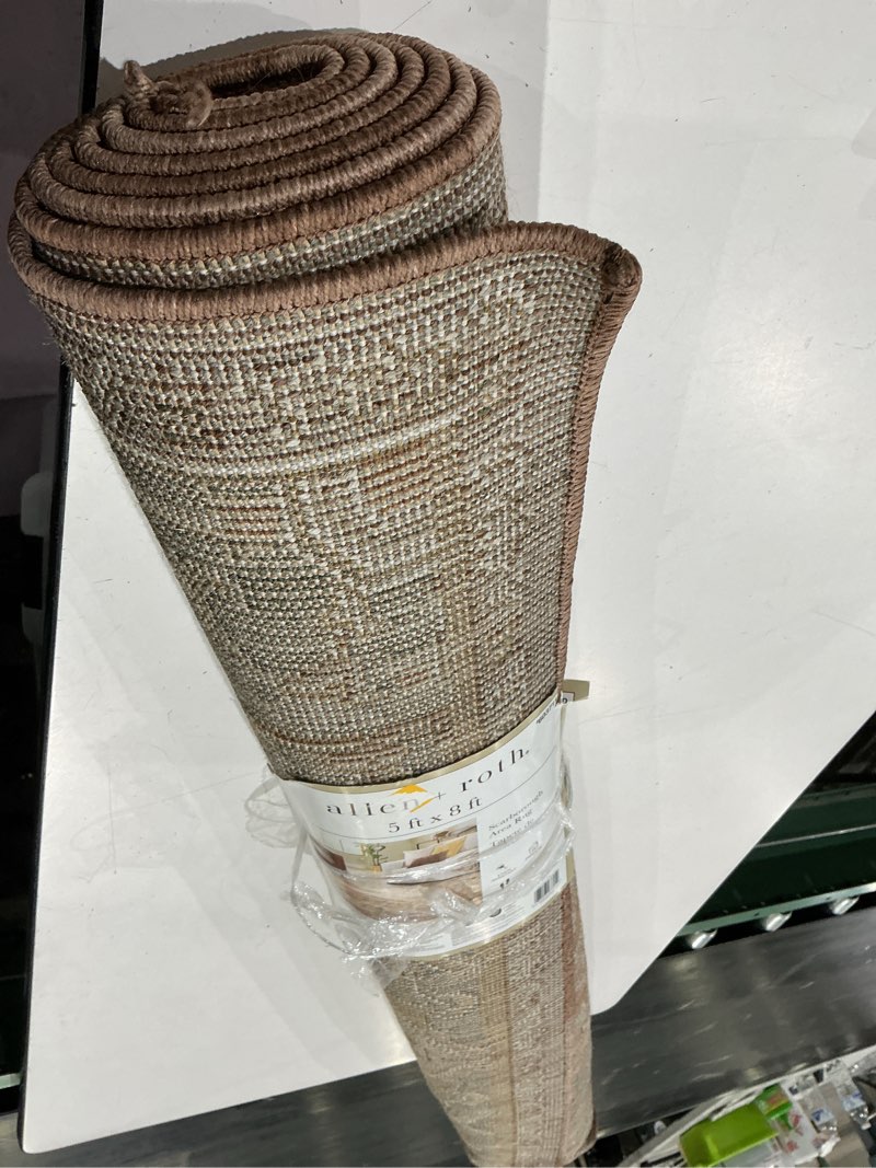 Condition photo showing As Is for allen + roth scarborough 5 x 8 (ft) loomed polyester rust rectangular indoor medallion