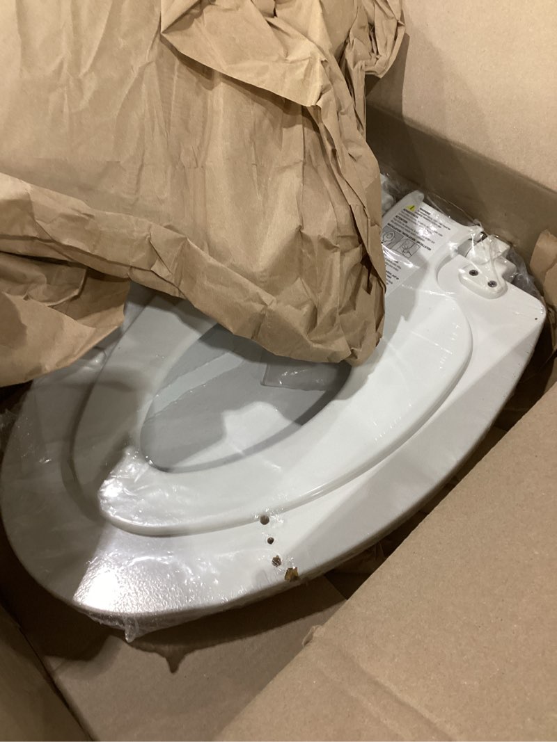 Condition photo showing item condition for mayfair nextstep2 toilet seat with built-in potty training seat, slow-close, removable that will never loosen, round, white round (1-pack) 1-pack