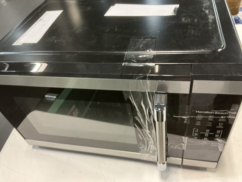 Condition photo showing As Is for hamilton beach 1.1 cu ft countertop microwave oven, stainless steel