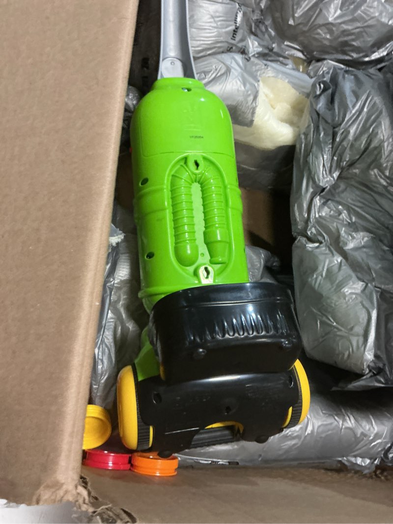 Condition photo showing As Is for leapfrog pick up and count vacuum, green