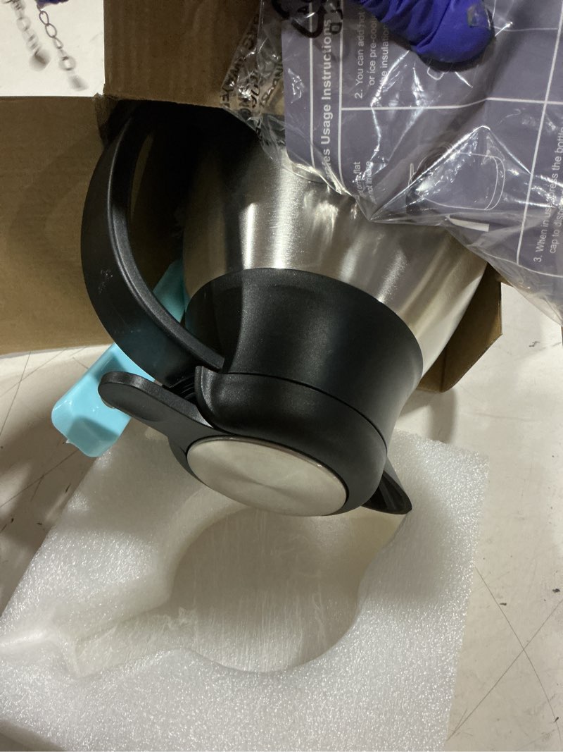 Condition photo showing As Is for thermal coffee carafe with hang tag, 2l/68 oz stainless steel vacuum insulated thermoses, double-wall design, 24-hour hot & cold, leak-proof, portable for travel,camping,office (silver)