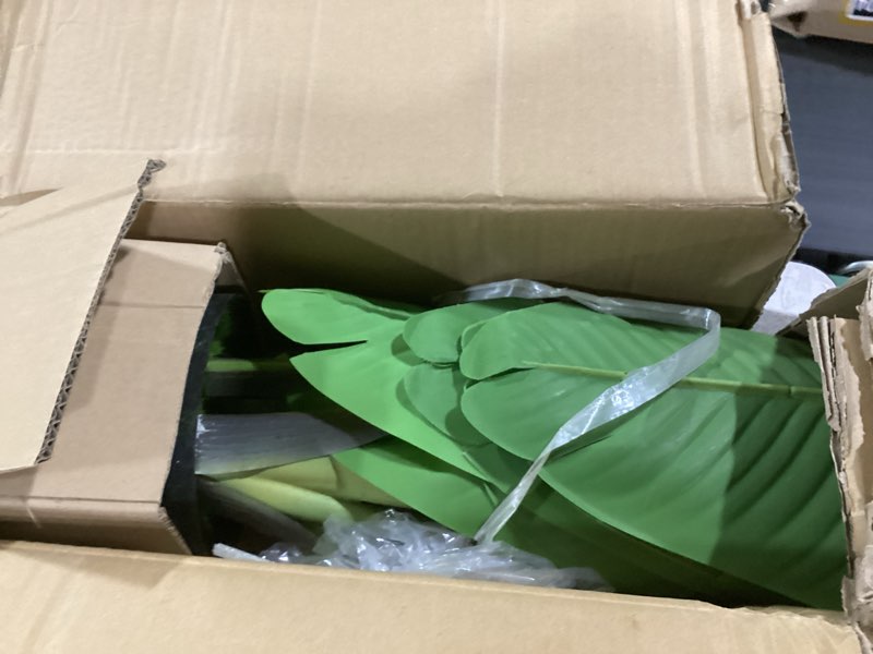 Condition photo showing As Is for vevor artificial bird of paradise tree, 5 ft tall faux plant, pe material & anti-tip tilt protection low-maintenance plant, lifelike green fake tree for home office warehouse decor indoor outdoor bird of paradise 5ft