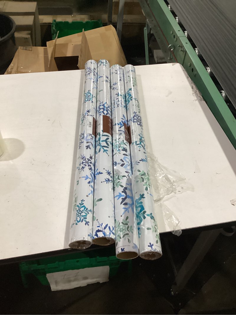Condition photo showing Good Condition for 4 rolls of snowflake wrapping paper