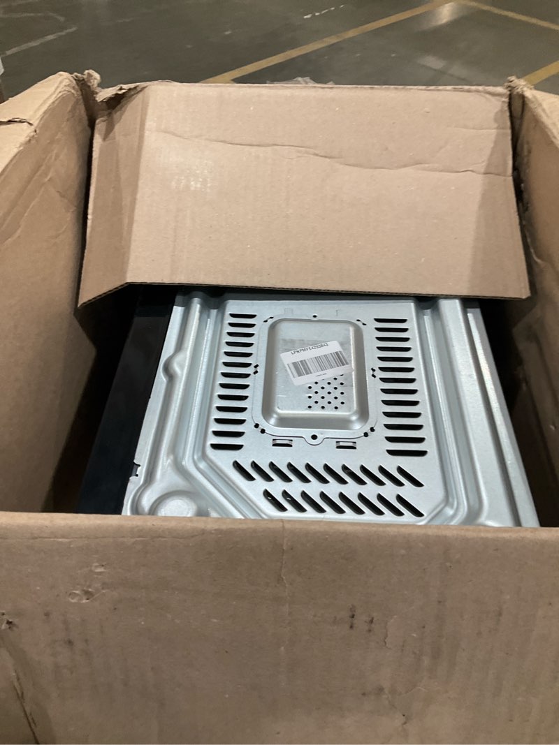 Condition photo showing As Is for Farberware 0.9 Cu. Ft. Countertop Microwave Oven – 900 Watts Power, Auto Cook Settings, Defrost, Easy Clean and Child Safety Lock - Stainless and Black 0.9 Cu. Ft Stainless Steel