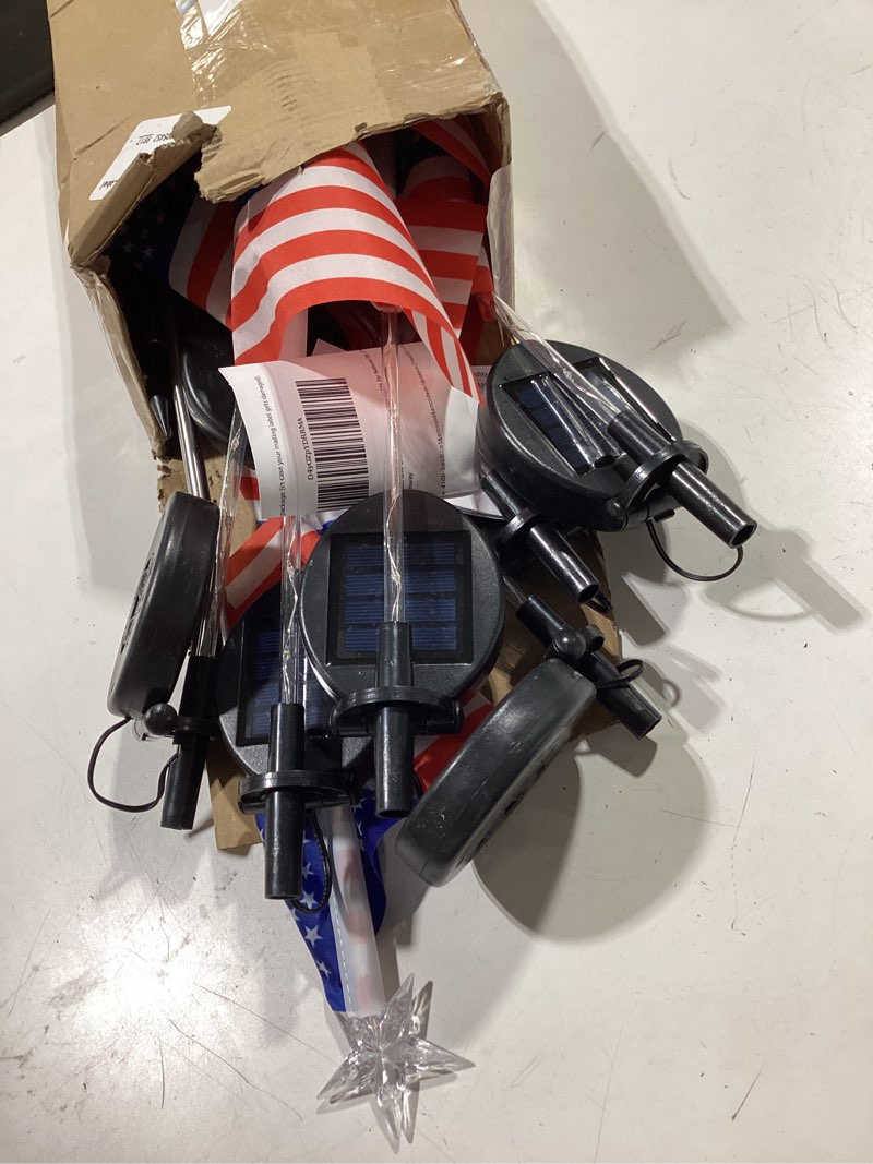 Condition photo showing As Is for 4th of july decorations outdoor solar lights, 12 pack red white and blue american flag star lights for national day, 2 modes waterproof solar patriotic light for independence memorial day yard pathway red white blue 12pk
