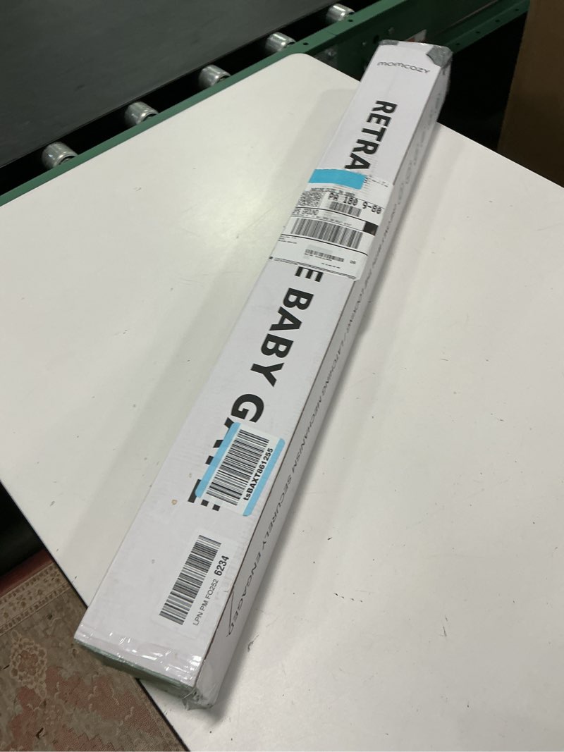 Condition photo showing Good Condition for Momcozy retractable baby gate