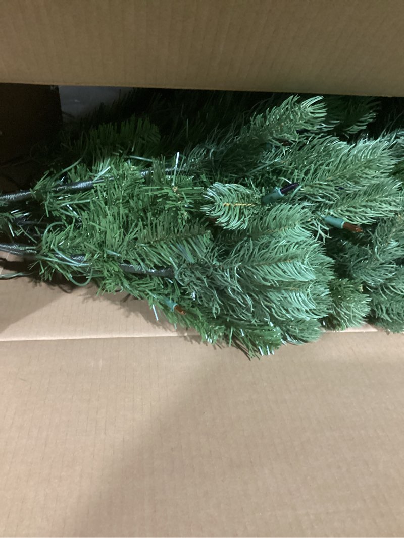 Condition photo showing Good Condition for National Tree Company 4.5 ft Pre-Lit Downswept Douglas Fir Artificial Christmas Tree, 450 Multicolor Lights, 525 Feel Real Tips, Includes Stand, Green 4ft 6in With 450 Multicolor Lights