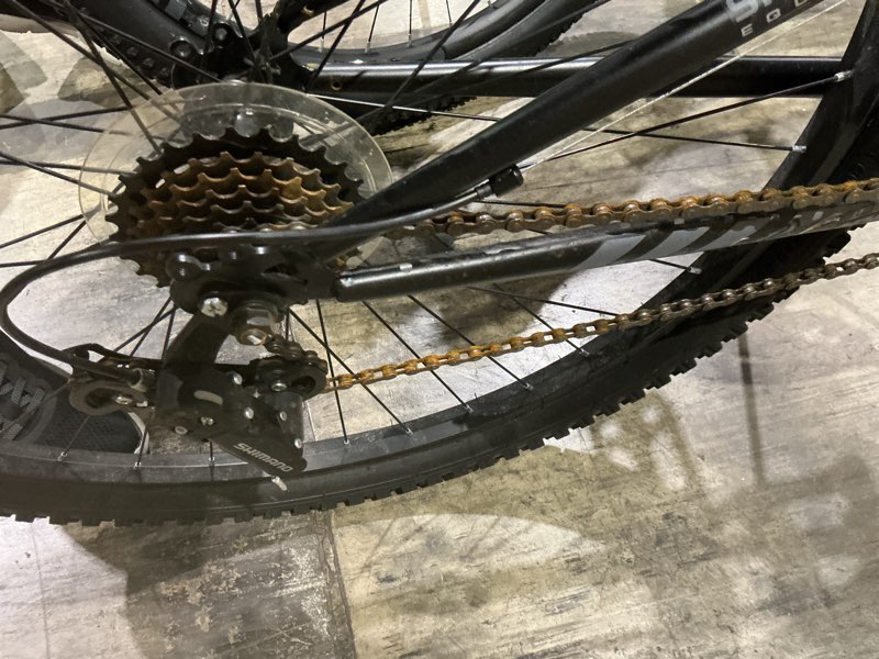 Condition photo showing As Is for damage to the chain and change tower schwinn axum comp, 29-in. adult unisex, mountain bike, medium frame, black