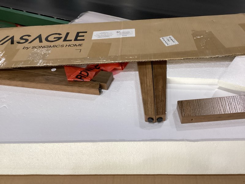 Condition photo showing As Is for VASAGLE MAEZO Collection - Coffee Table, 2-Tier Center Table with Storage, Tapered Legs, Curved Transitions, 21.7 x 39.4 x 17.7 Inches, Easy to Assemble, for Living Room, Honey Brown ULCT249K01