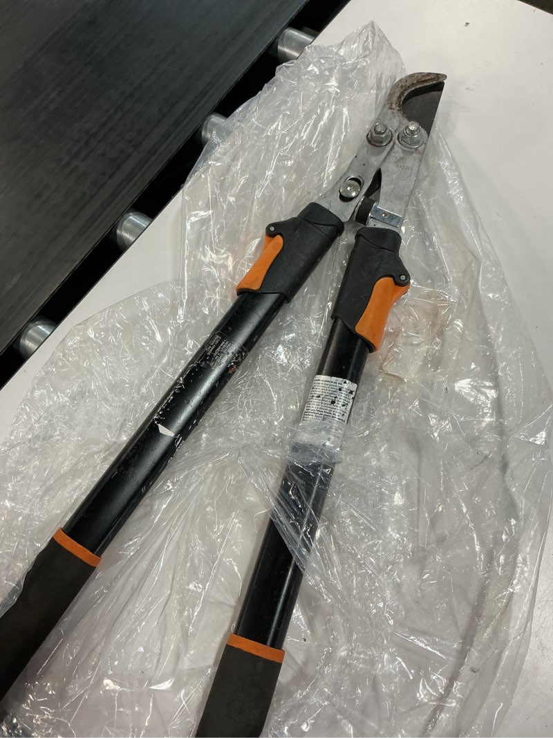 Condition photo showing As Is for 1-3/4 in. cut capacity steel blade, 25 in. - 37 in. power-lever bypass lopper with extendable handles