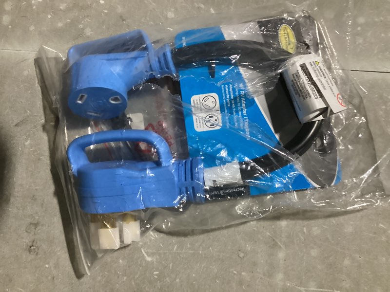 Condition photo showing As Is for road & home road and home 30-amp adapter