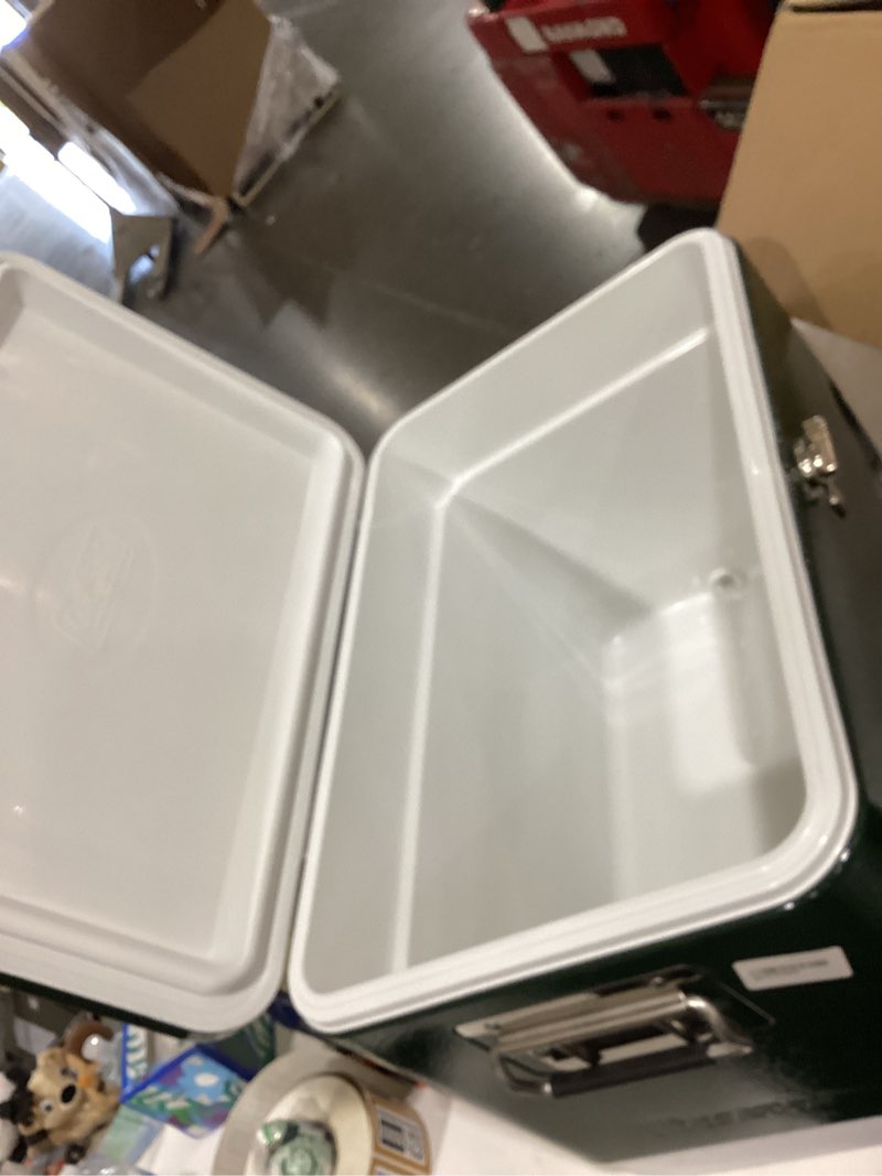 Condition photo showing As Is for coleman vintage 54qt steel belted cooler, keeps ice up to 4 days, 85-can capacity hard cooler with drain & have-a-seat lid green