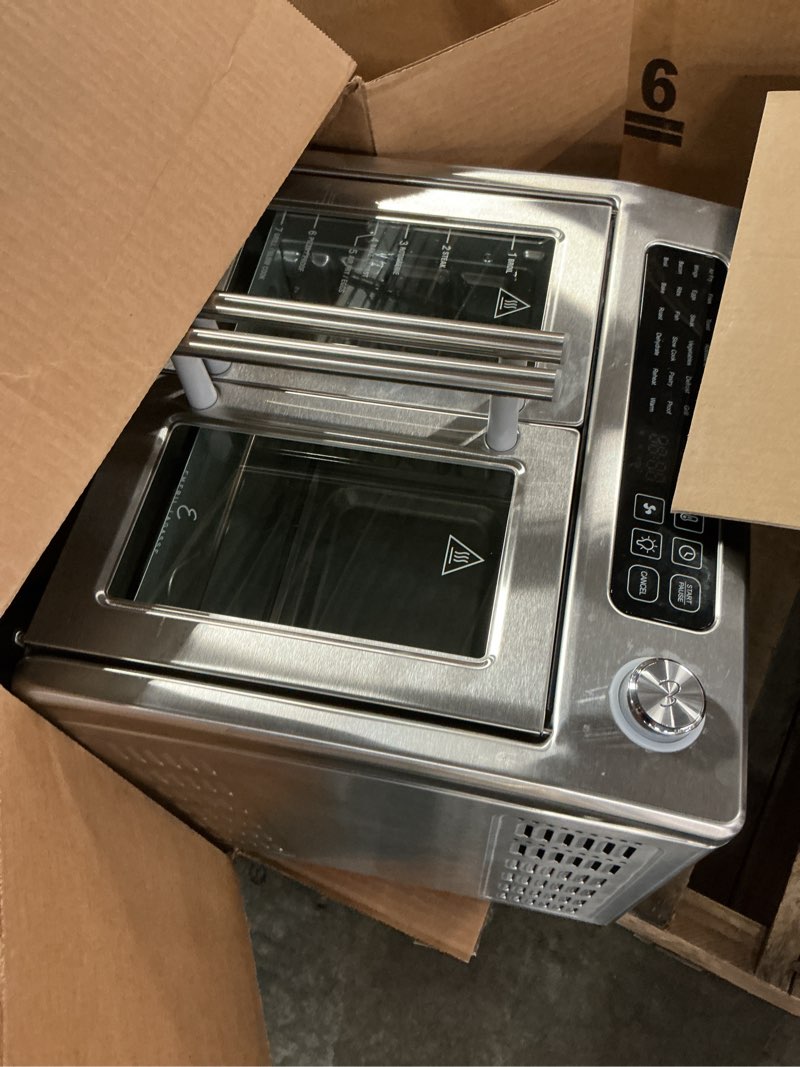 Condition photo showing As Is for Dan - Emeril Lagasse Extra Large French Door Air Fryer Toaster Oven Combo, 24 Cooking Functions and Digital Controls, 7 Accessories Included, Stainless Steel Finish, 26QT Capacity