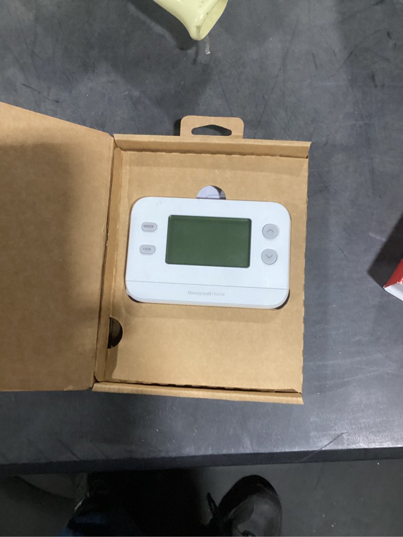 Condition photo showing As Is for honeywell home x1n heating and cooling push button non-programmable thermostat