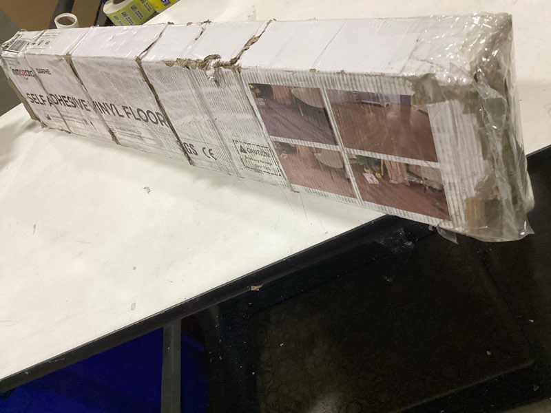 Condition photo showing As Is for Similar to Wood Grain Peel and Stick Floor Tiles – 11.8” Width, Full Roll Length of 118\" – Versatile Design for Any Space, Grey Self Adhesive Vinyl Flooring, Waterproof and Non-Slip Features 118\"*11.8\" Grey 1