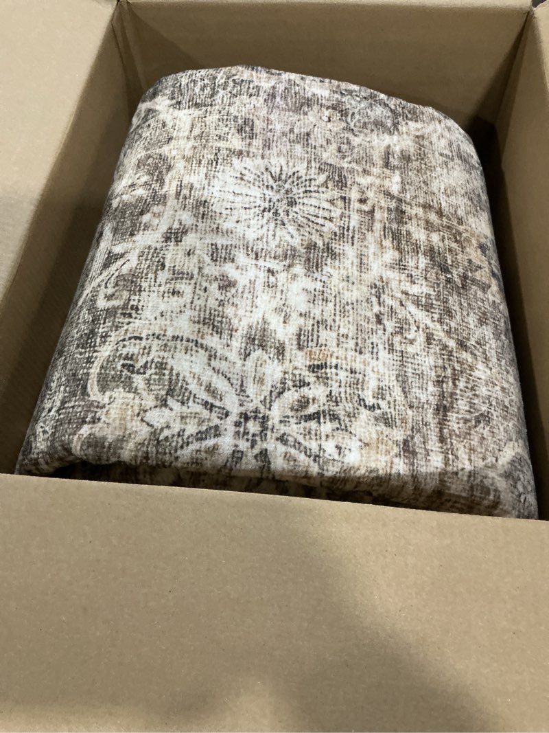 Brown and biege rug unknown size