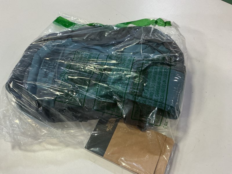 Condition photo showing New/Like New for the north face borealis siing bag | crossbody adjustable strap, water repellent finish, multiple compartments, tablet sleeve one size space/anthracite grey