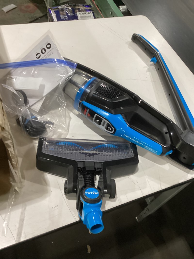 Condition photo showing As Is for missing accessories bissell, 3061 featherweight cordless stick vacuum, self-standing, electric blue, black