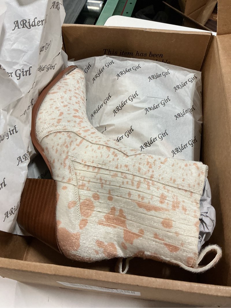 Condition photo showing New/Like New for white & beige faux hair on cow print booties (size 7.5)