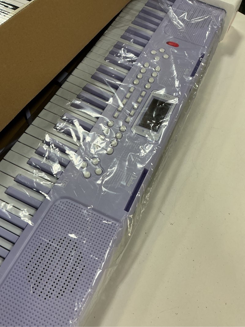 Condition photo showing Good Condition for Piano Keyboard, 61 Key Upgrade Kids Pianos Music Toy with Light-up Keys & Pro Teaching Modes, Dual Speaker, 70 Demos,100 Tones, 100 Rhythms Perfect Christmas/Birthday Gift for Kids (Purple)