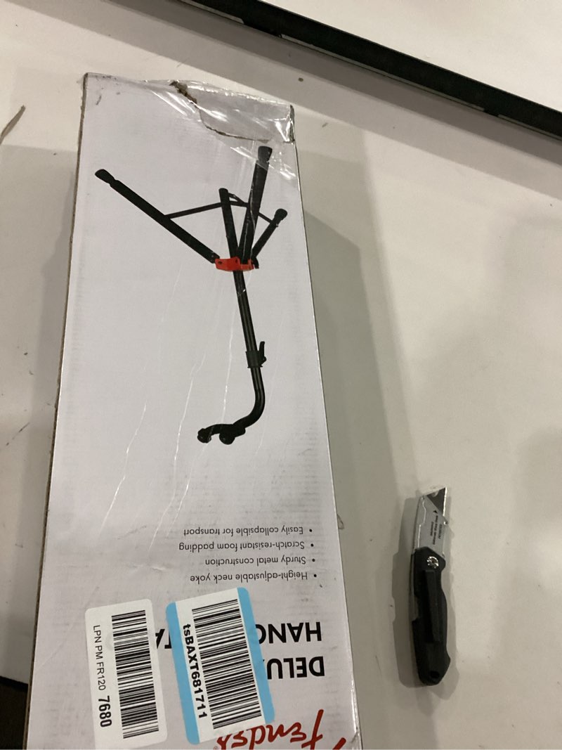 Condition photo showing Good Condition for fender deluxe hanging guitar stand, height-adjustable neck yoke, metal construction, can support acoustic, electric, and bass guitars, padded support