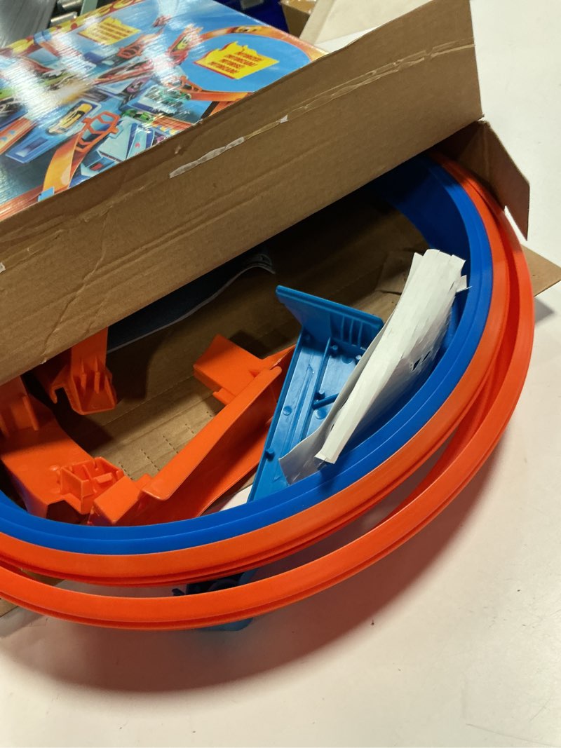 Condition photo showing As Is for hot wheels track set with 1:64 scale toy car, 4 intersections for crashing, powered by a motorized booster, criss-cross crash track (amazon exclusive) criss cross crash