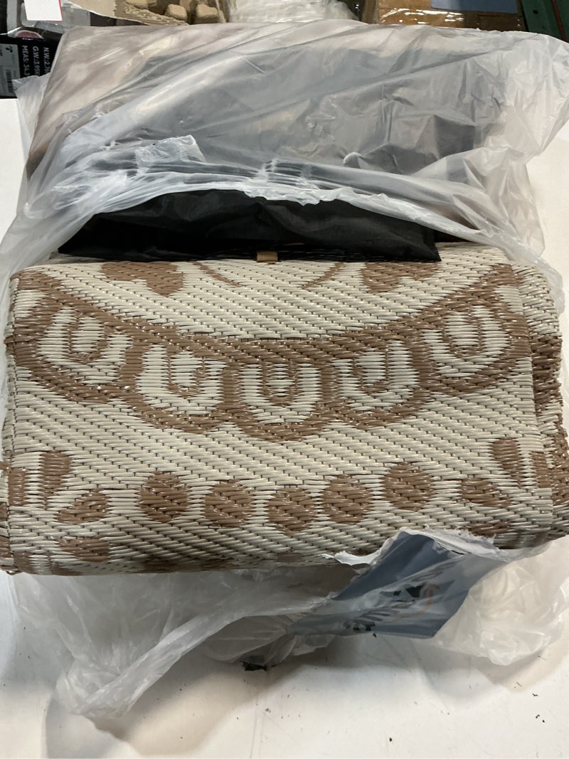 Condition photo showing Good Condition for bsmathom waterproof outdoor rug 6'x9' reversible boho plastic straw patio deck camping rugs, indoor outdoor portable rv mat clearance carpet for outside, porch, balcony, backyard, beach, pool,brown flower brown 6' x 9'