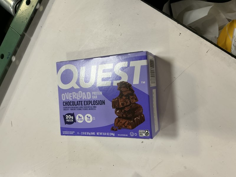 Condition photo showing New/Like New for (best by 06/16/26) quest nutrition overload protein bars, chocolate explosion, 20g protein, 1g sugar, 3g net carbs, glu
