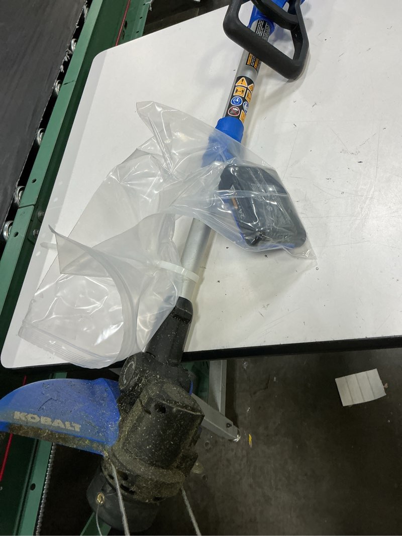 Condition photo showing As Is for kobalt 24-volt 12-in telescopic shaft battery string trimmer edger conversion capable 3 ah (battery included) (charger included)
