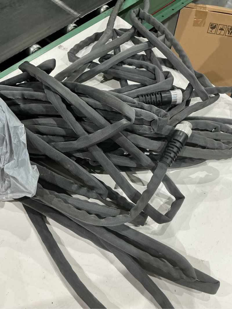 Condition photo showing As Is for  5/8 in. x 50 ft. heavy duty fabric garden hose