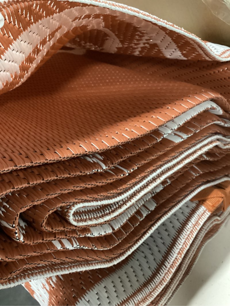 Condition photo showing Good Condition for garvee reversible outdoor rug 6x9, waterproof outdoor plastic straw rug with interlacing pattern, rv mat for picnics, patio, camping, balcony, deck, backyard, porch, orange orange-style1 6' x 9' (rectangular)
