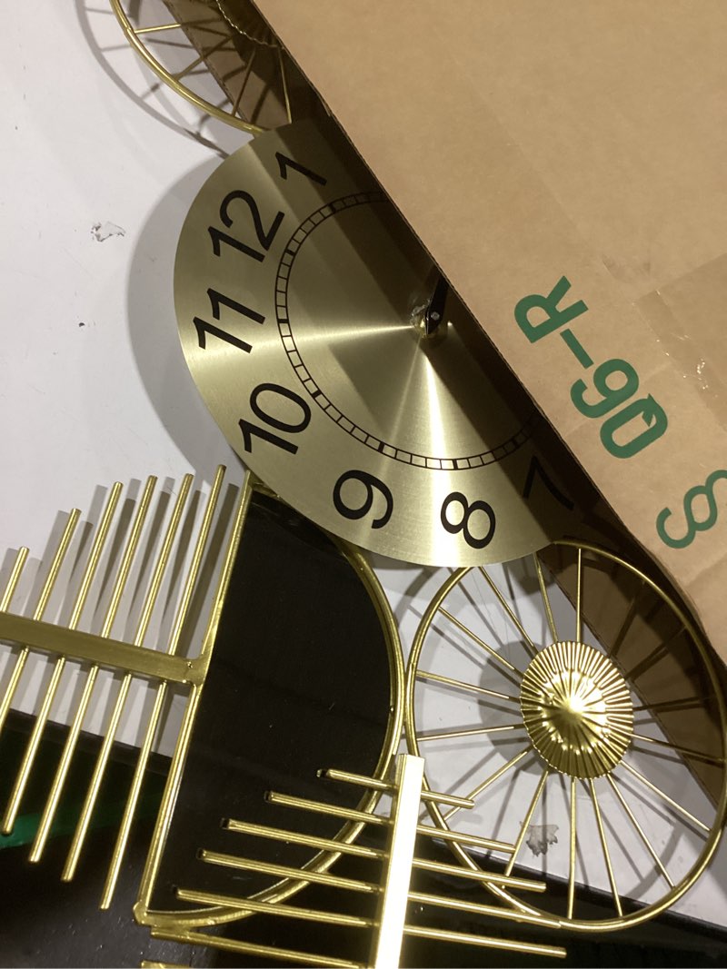 Condition photo showing Good Condition for Large Wall Clock,Modern Silent Non-Ticking Metal Wall Art Wall Clocks Battery Operated, Horizontal or Vertical Hanging Clock for Living Room, Kitchen, Bedroom, or Office Wall Decor (40") Gold-large