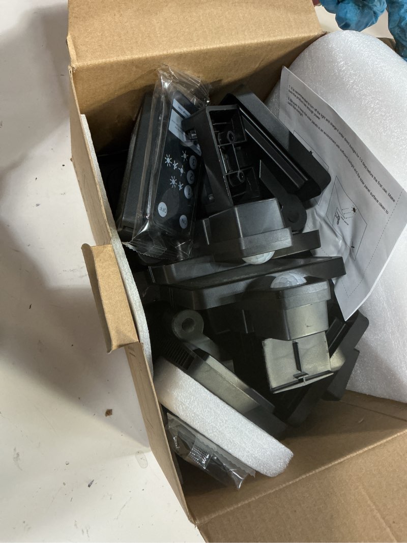 Condition photo showing As Is for tuffenough solar outdoor lights 2500lm 210 led security lights with remote control,3 heads motion sensor lights, ip65 waterproof,270° wide angle flood wall lights with 3 modes(2 packs)