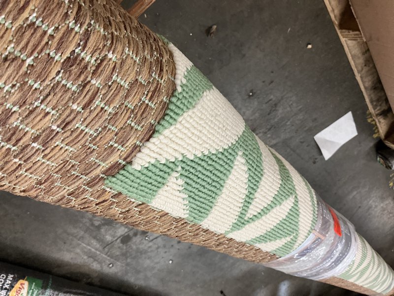 Condition photo showing Good Condition for hampton bay green 6 ft. x 9 ft. indoor/outdoor leaf layering area rug